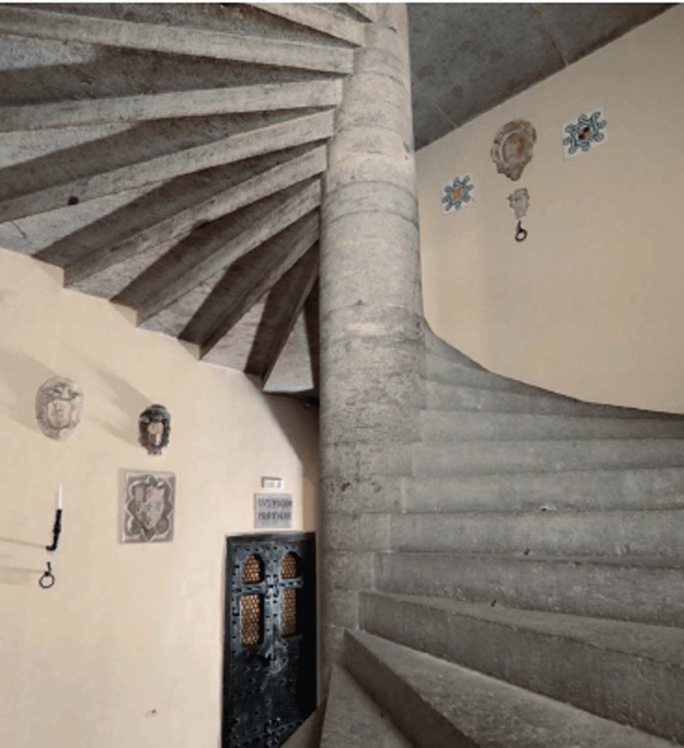 Spiral staircase in piperno and volcanic stone leading from the Carlo Filangieri Hall to the upper floors